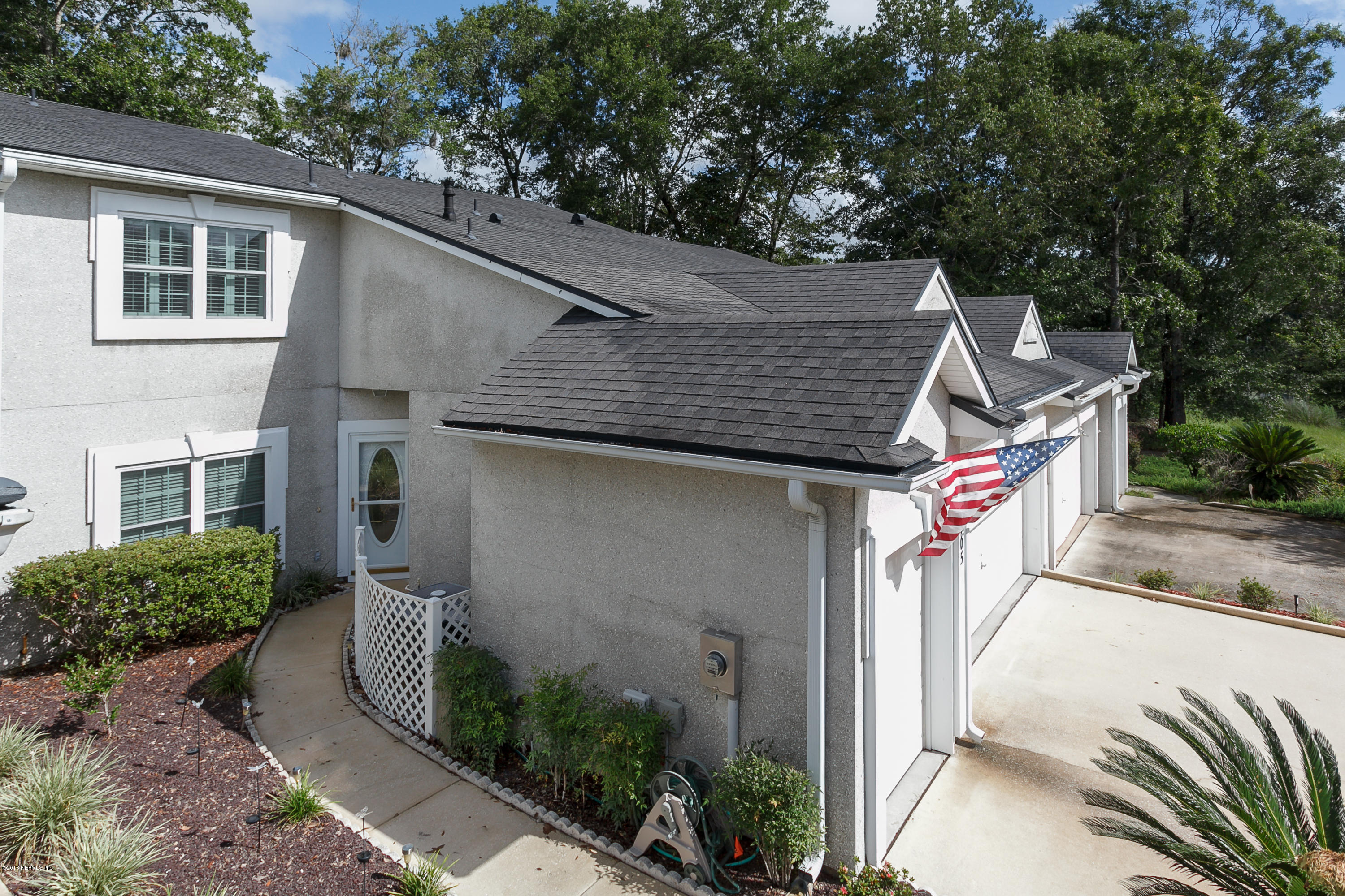 3105 Ravines Road Middleburg, FL 32068 - Photo 2 of 32 a front view of a house with garden