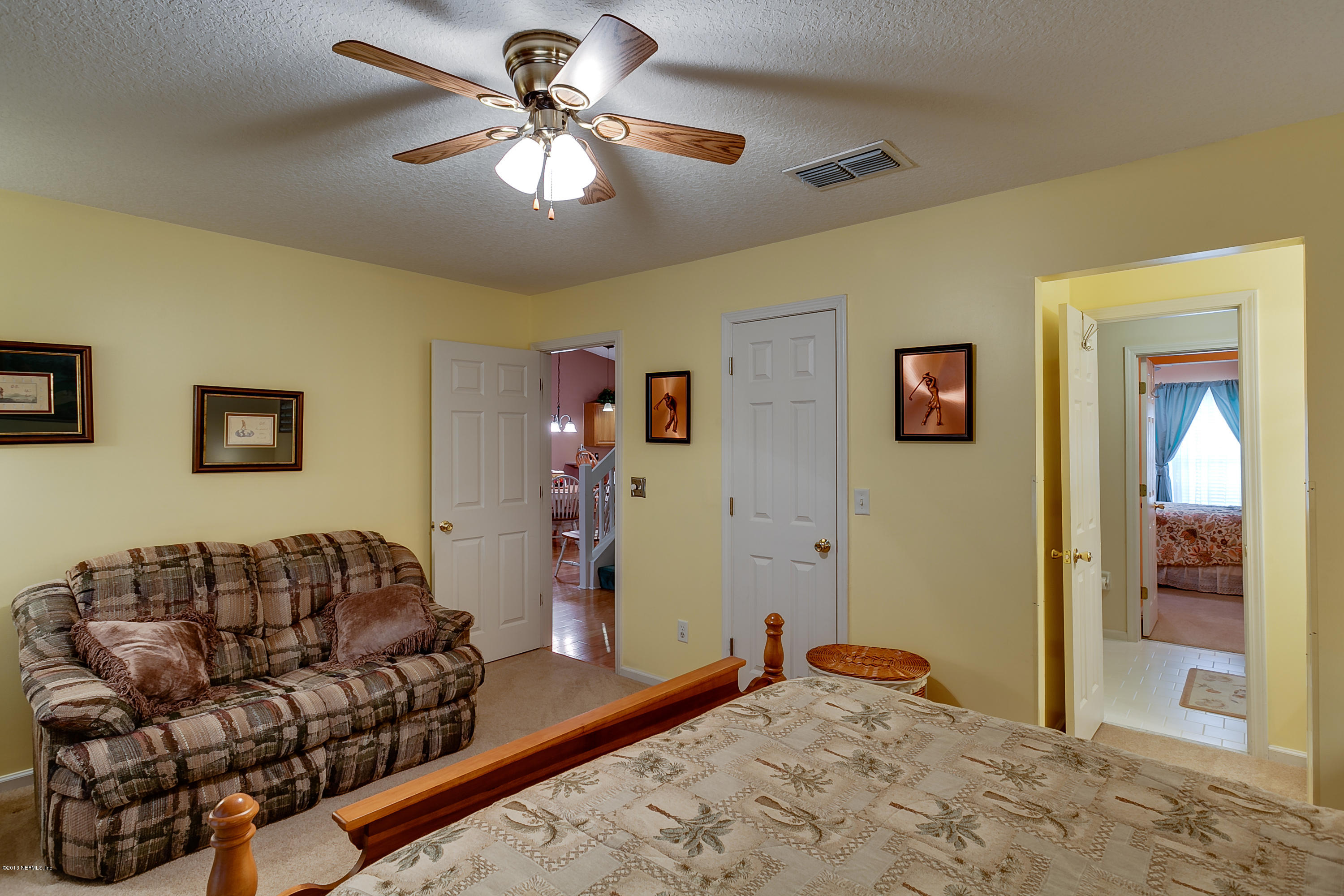3105 Ravines Road Middleburg, FL 32068 - Photo 29 of 32 a living room with furniture ceiling fan and a window