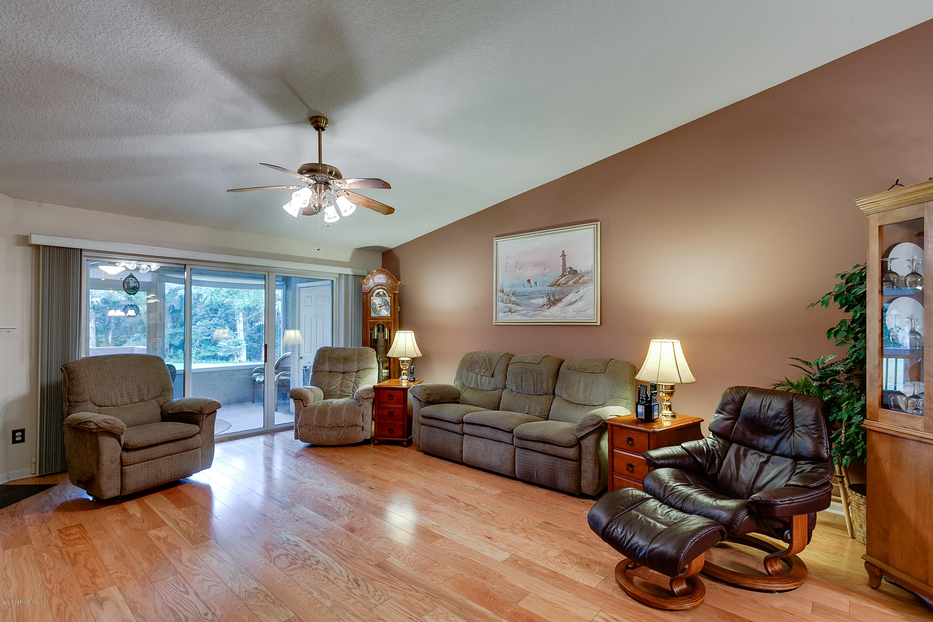3105 Ravines Road Middleburg, FL 32068 - Photo 3 of 32 a living room with furniture and a large window