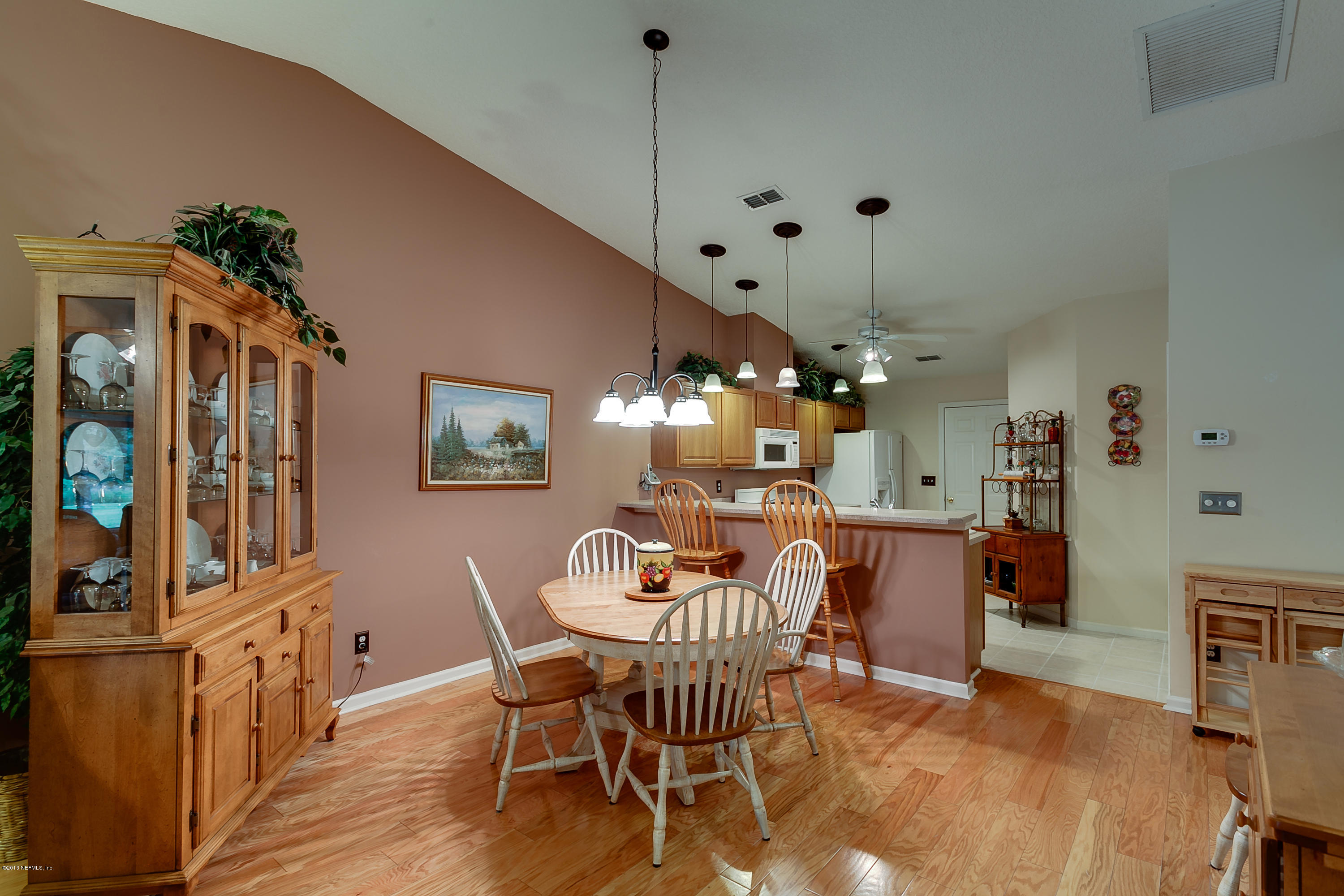 3105 Ravines Road Middleburg, FL 32068 - Photo 8 of 32 a dining room with furniture and window