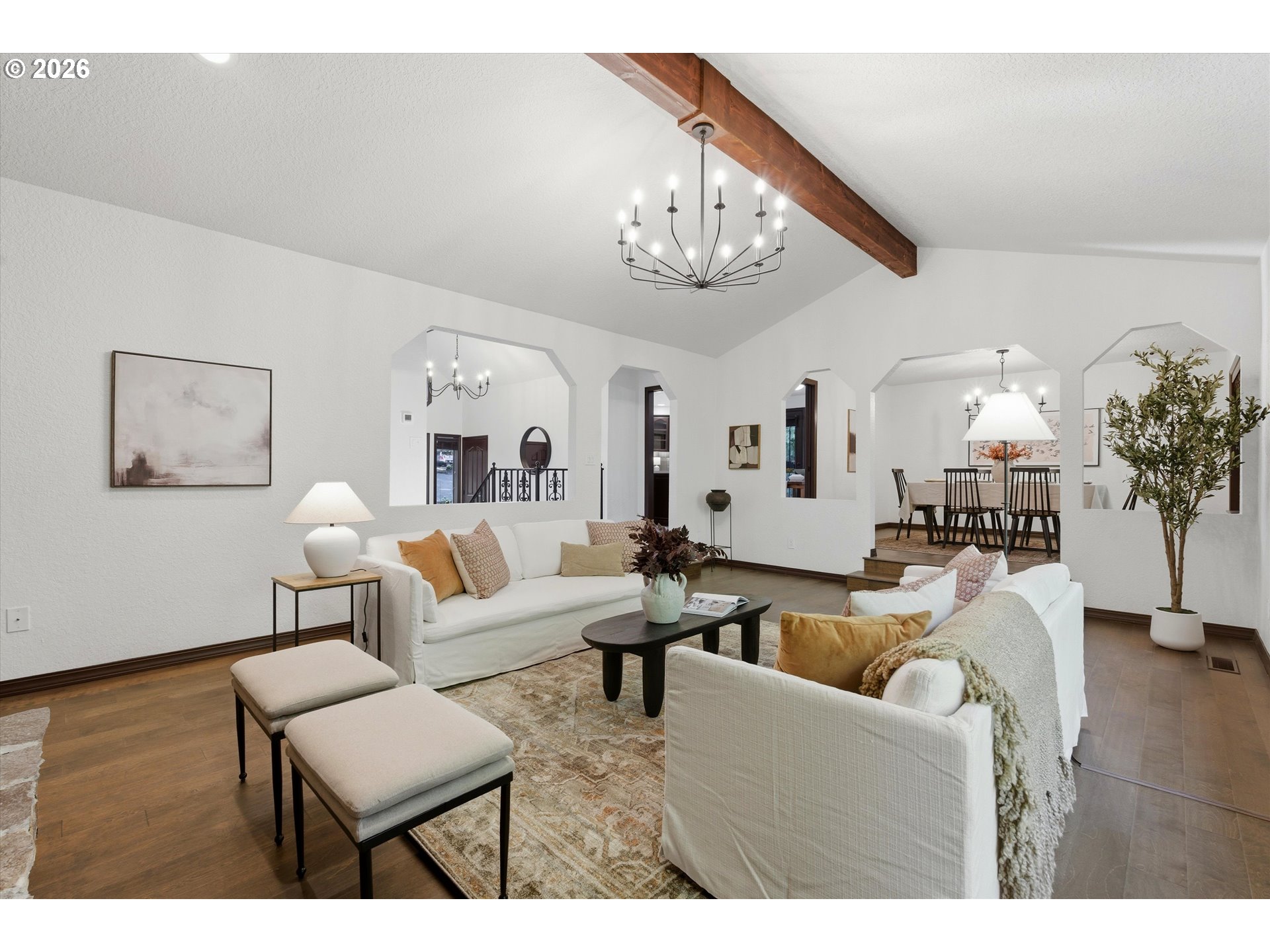 7236 Southeast 133rd Place Portland, OR 97236 - Photo 12 of 42 a living room with furniture a chandelier and a dining room