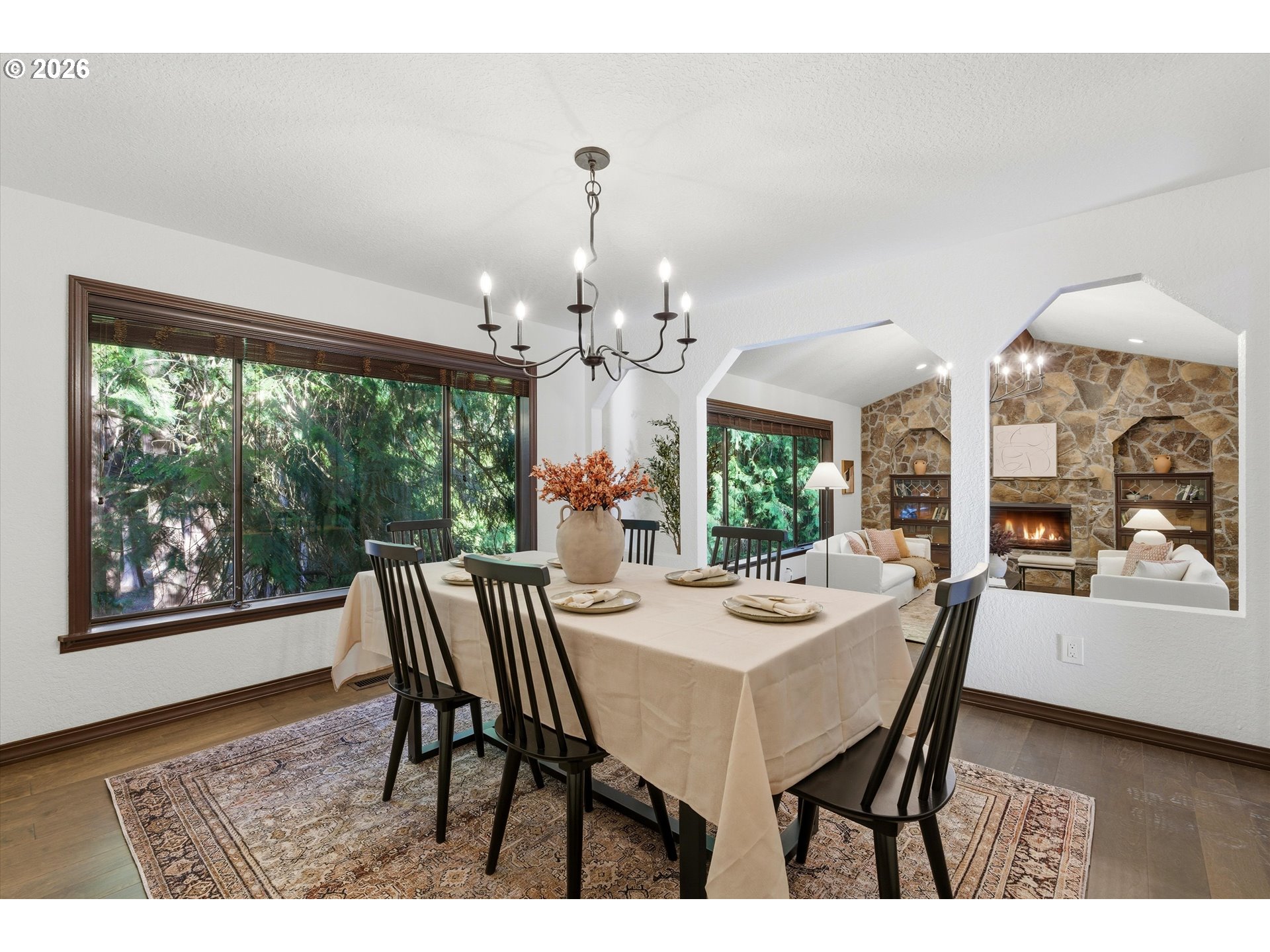 7236 Southeast 133rd Place Portland, OR 97236 - Photo 13 of 42 a view of a dining room with furniture a chandelier and wooden floor