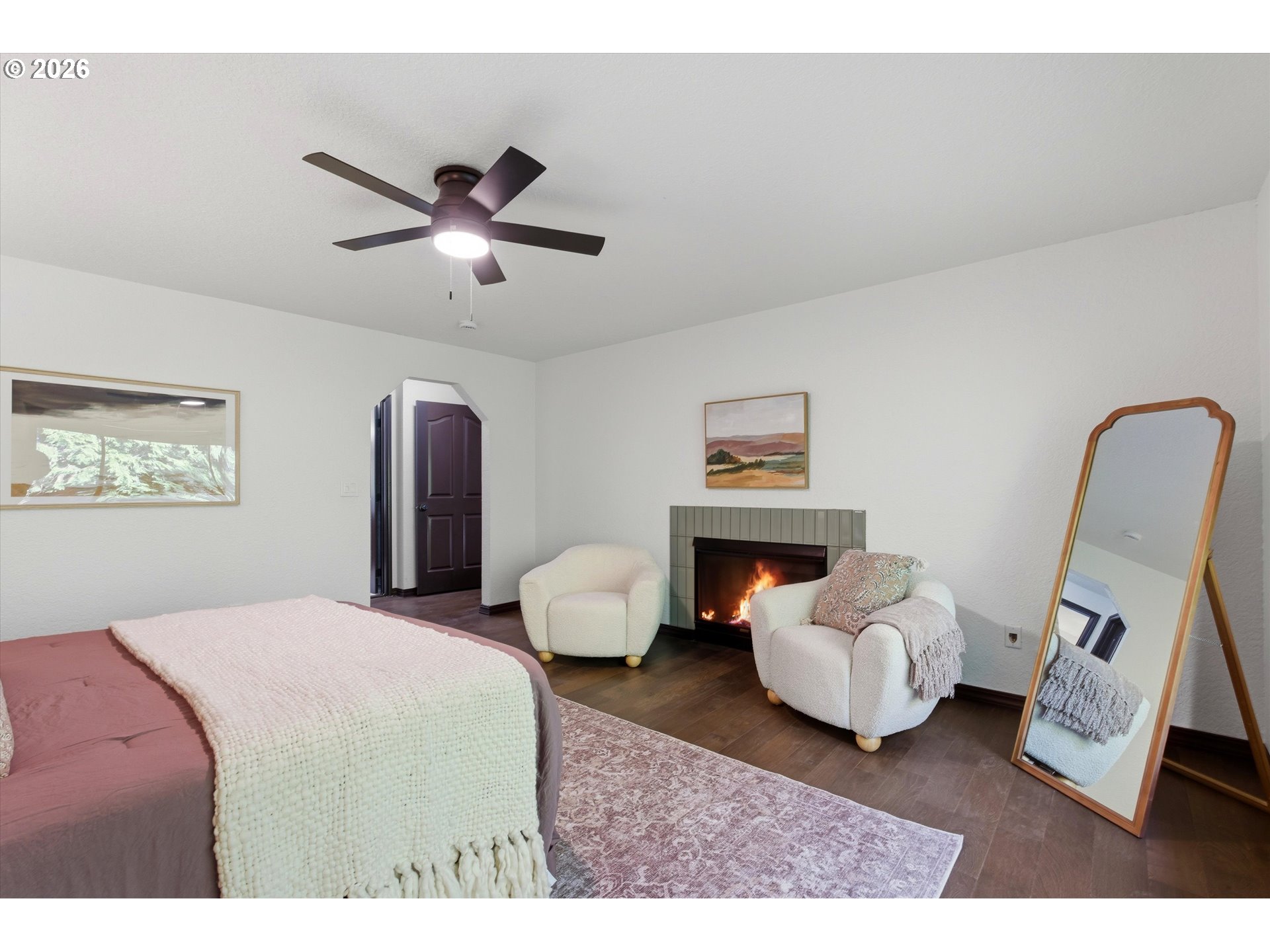 7236 Southeast 133rd Place Portland, OR 97236 - Photo 23 of 42 a spacious bedroom with a bed and a chandelier