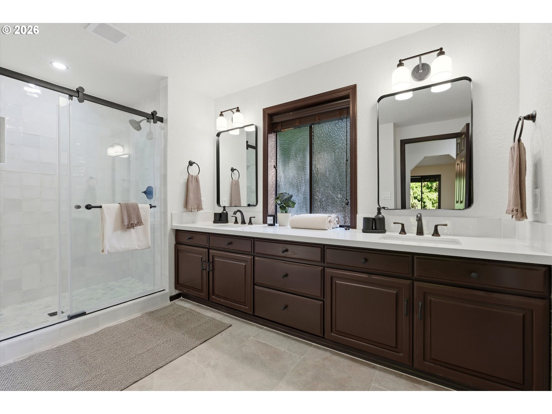 7236 Southeast 133rd Place Portland, OR 97236 - Photo 24 of 42 a bathroom with a double vanity sink mirror and shower