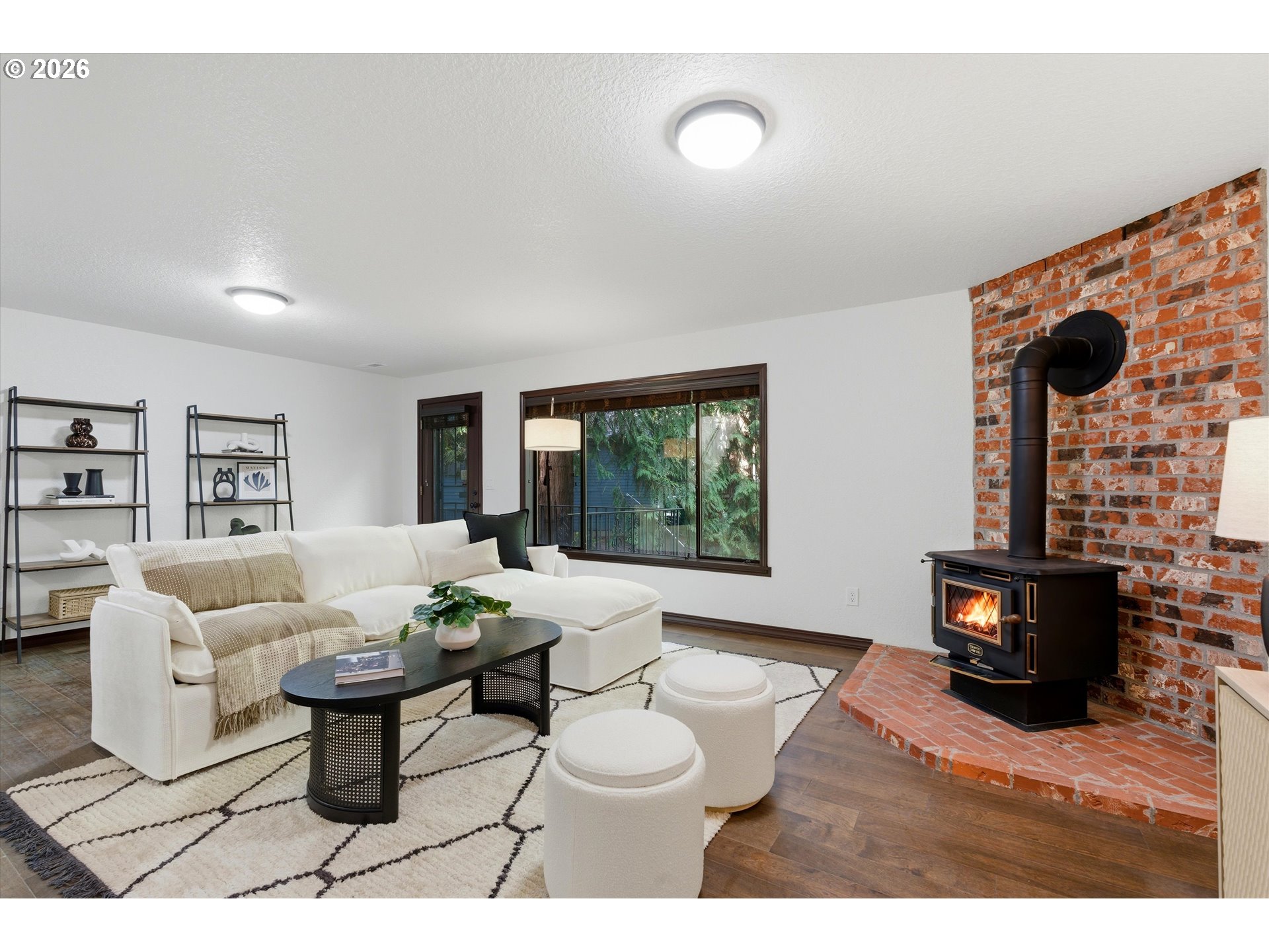 7236 Southeast 133rd Place Portland, OR 97236 - Photo 27 of 42 a living room with furniture a fireplace and a flat screen tv