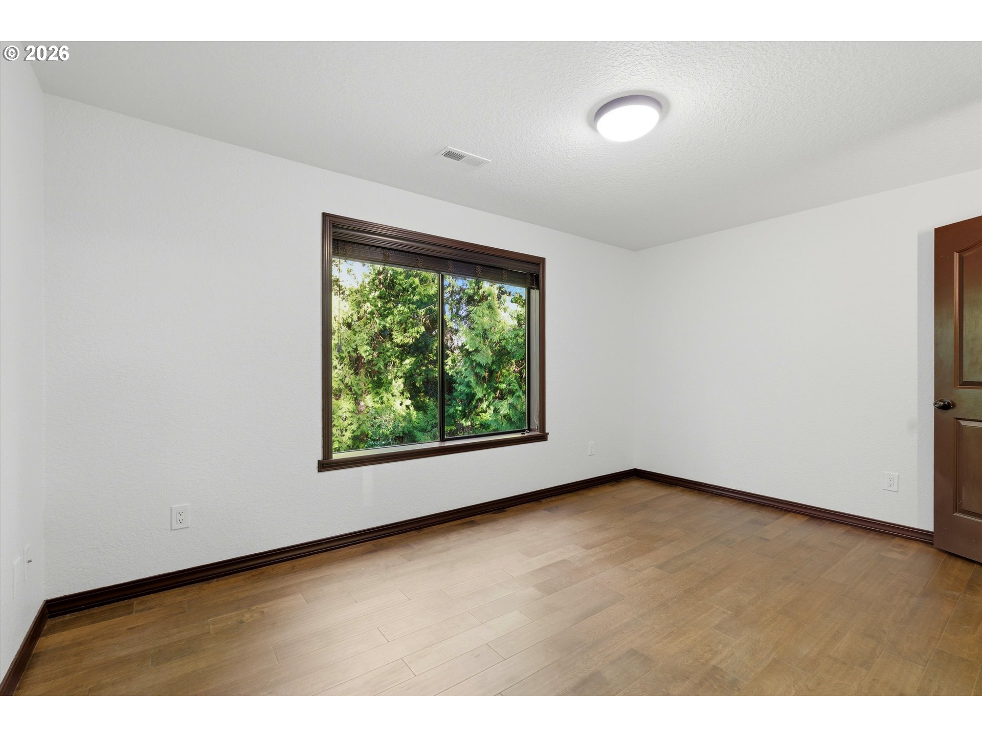 7236 Southeast 133rd Place Portland, OR 97236 - Photo 36 of 42 a view of a room that has a window in it