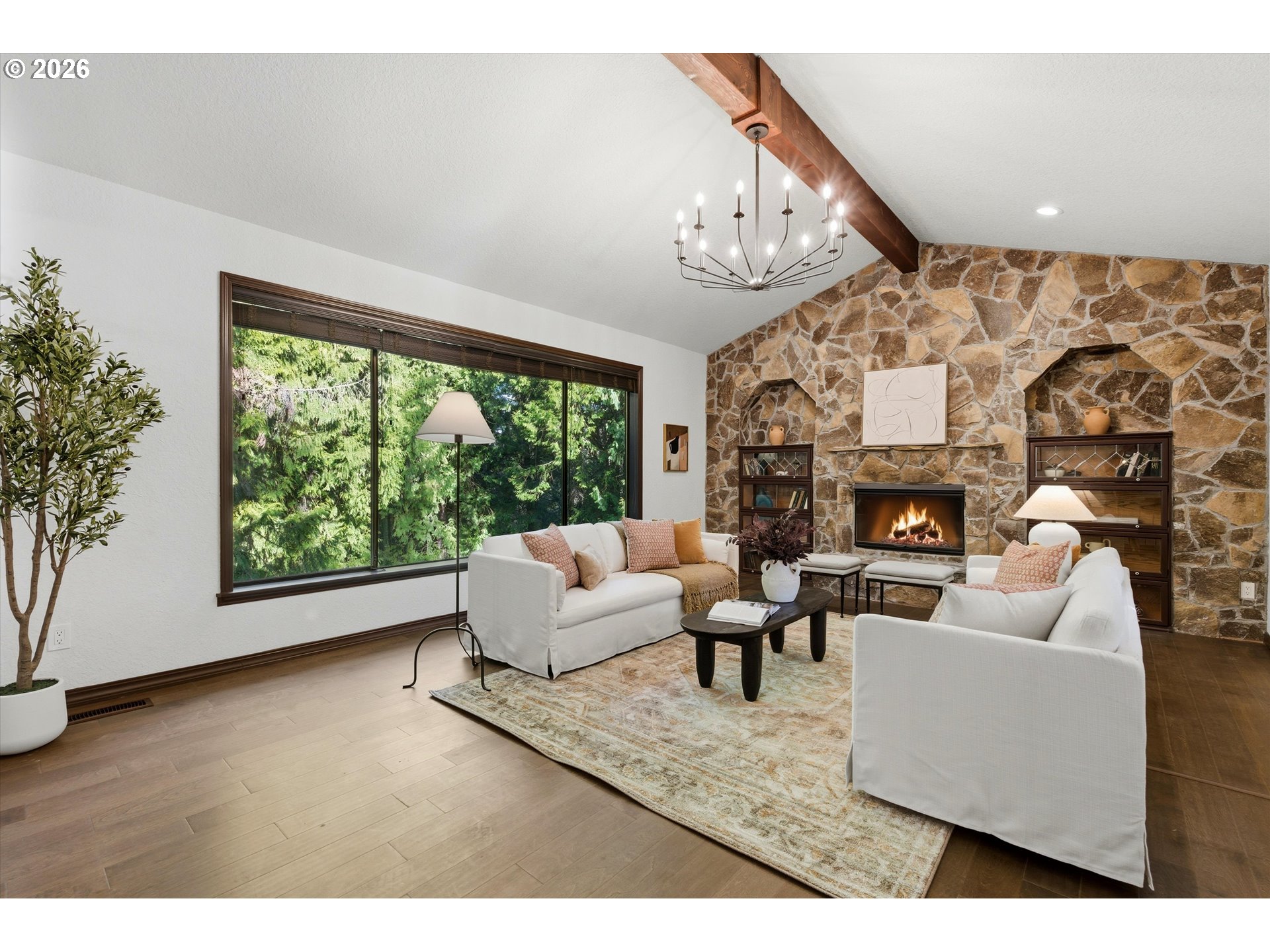 7236 Southeast 133rd Place Portland, OR 97236 - Photo 10 of 42 a living room with furniture a large window and a fireplace
