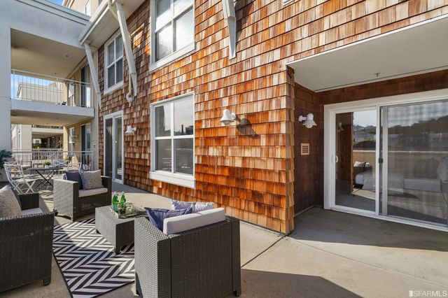 a balcony with furniture and city view
