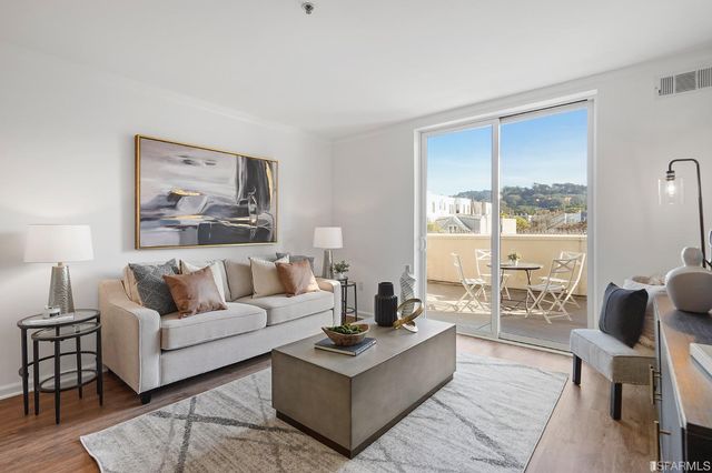 a bed room with a bed window and a table