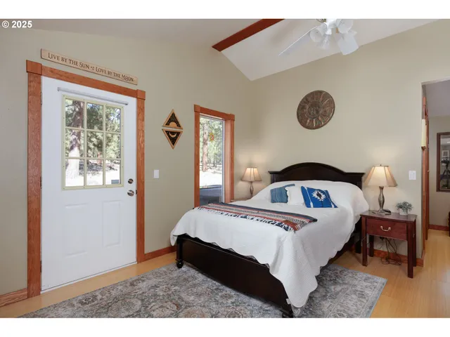 a bedroom with a bed and a lamp