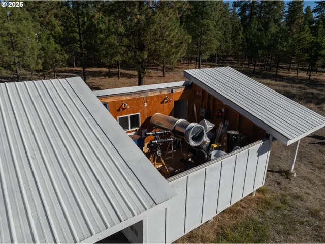 a view of a backyard with sitting area
