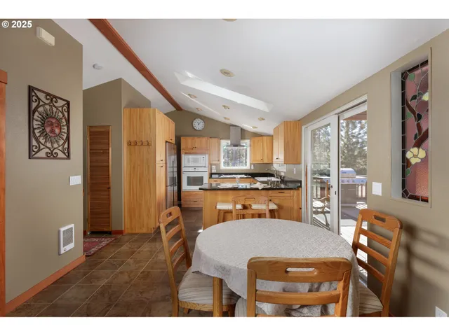 a outdoor dining space with furniture and window