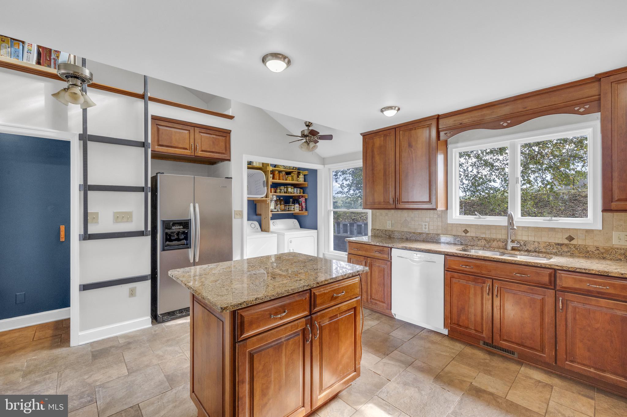 8729 Green Road Warrenton, VA 20187 - Photo 14 of 42 a kitchen with stainless steel appliances granite countertop a sink stove and refrigerator