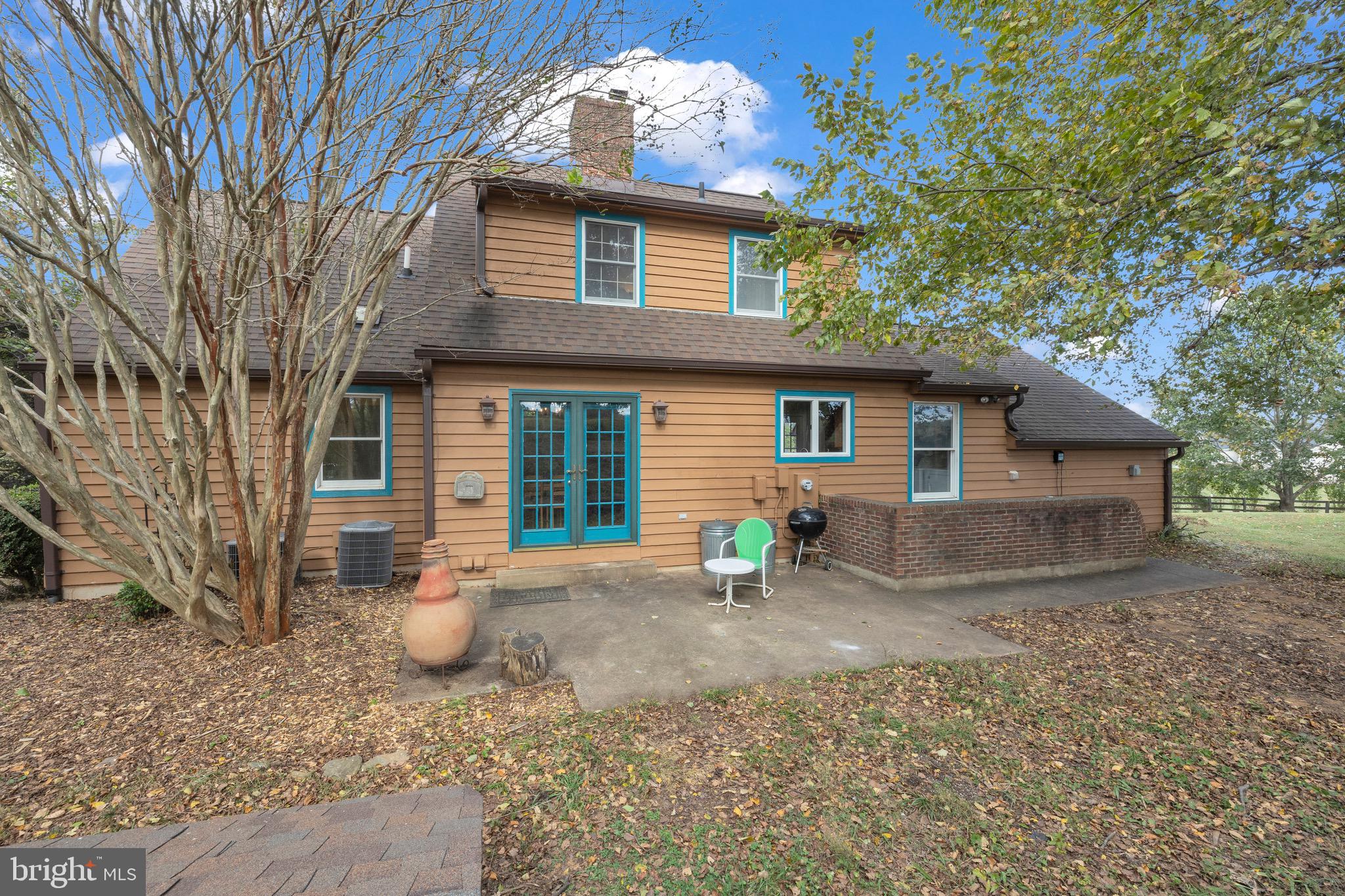 8729 Green Road Warrenton, VA 20187 - Photo 4 of 42 a front view of a house with a yard and seating space