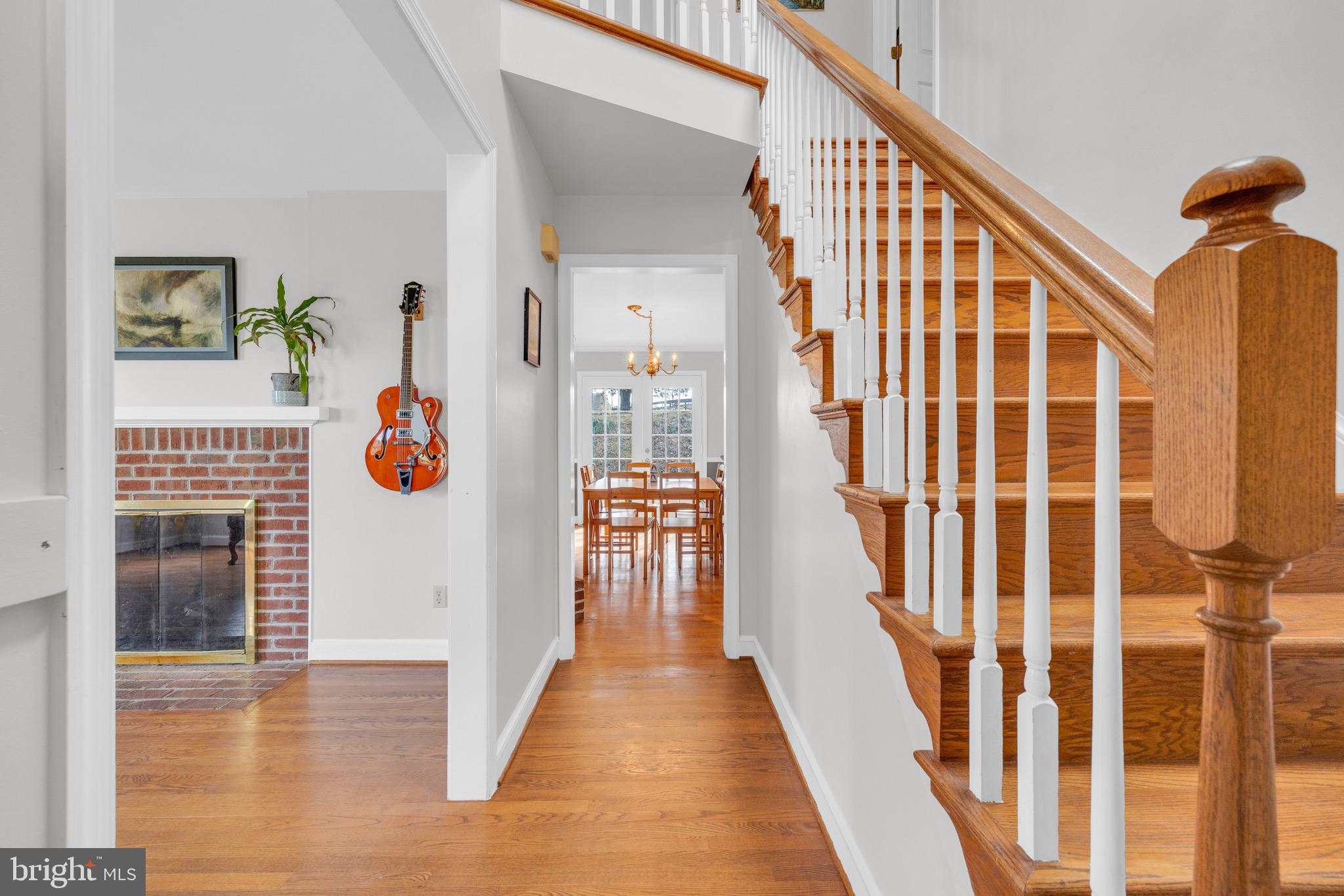 8729 Green Road Warrenton, VA 20187 - Photo 10 of 42 a view of staircase with wooden floor and windows