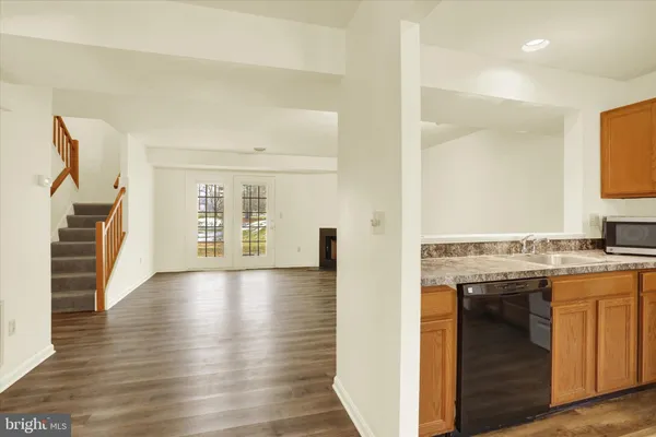 a view of a kitchen cabinets and wooden floor
