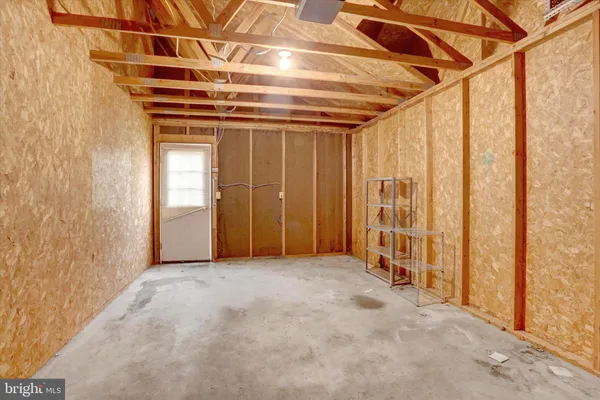 a view of a room with wooden walls