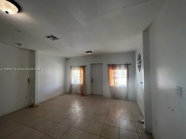 a view of an empty room and window