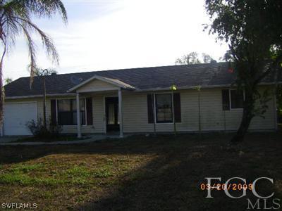 17509 Lee Road Fort Myers, FL 33967 - Photo 1 of 1 a front view of a house with garden