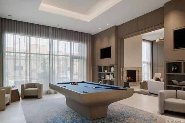 a living room with furniture fireplace and a flat screen tv