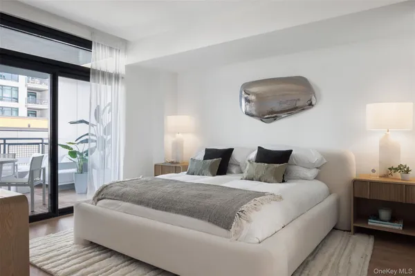 a bedroom with a large bed and a window