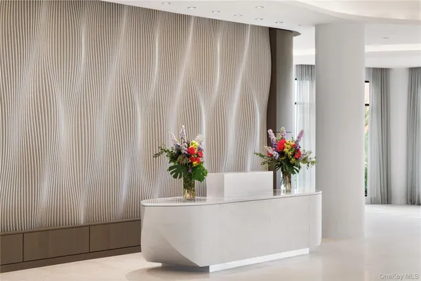 a white bath tub with a potted plant