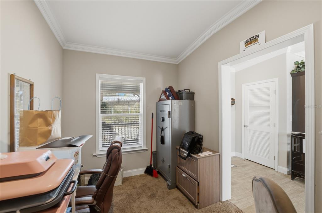 6844 Chad Jason Road St. Cloud, FL 34773 - Photo 36 of 59 a view of a workspace with furniture and a window