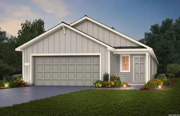 a view of a house with a yard and garage