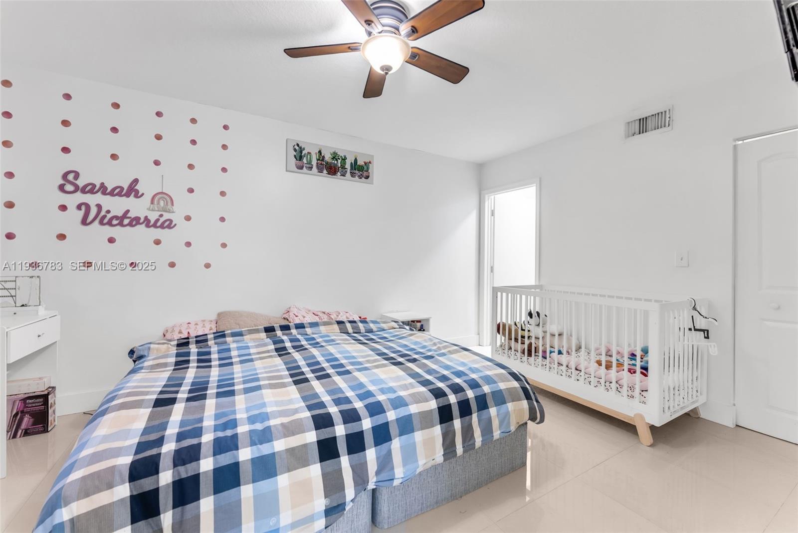 3725 Southwest 153rd Court Miami, FL 33185 - Photo 14 of 22 a bedroom with a bed and a window