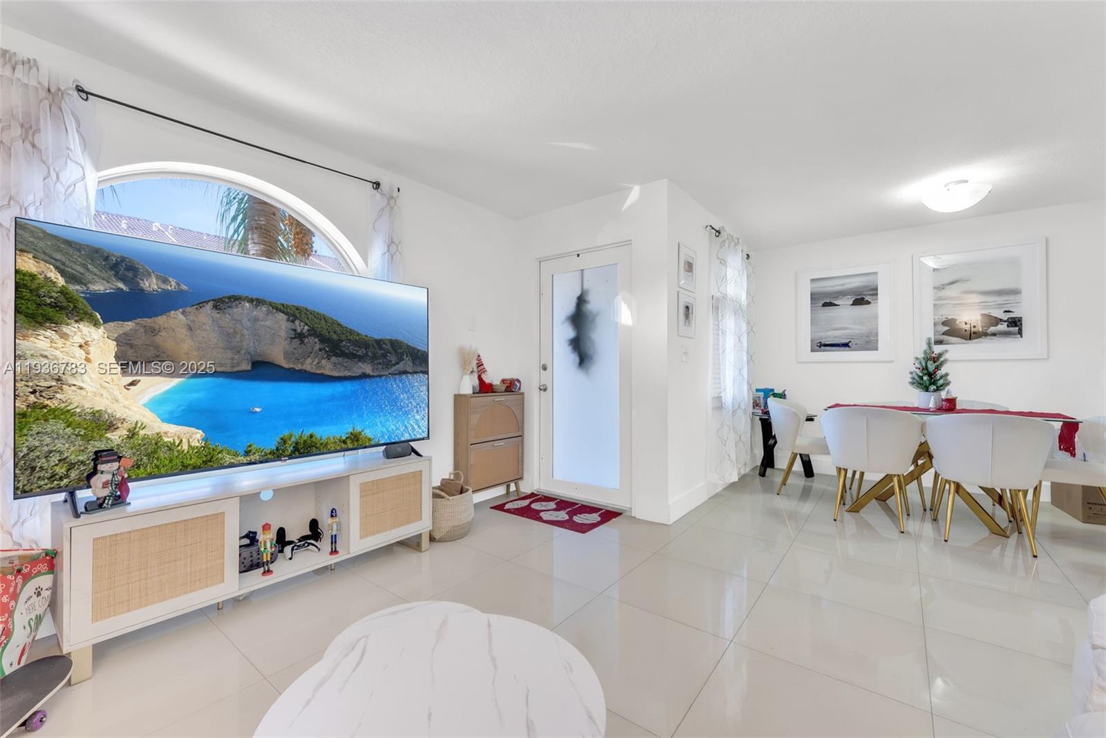 3725 Southwest 153rd Court Miami, FL 33185 - Photo 2 of 22 a living room with furniture and a table