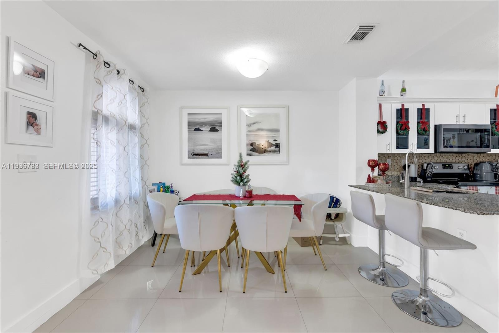 3725 Southwest 153rd Court Miami, FL 33185 - Photo 3 of 22 a view of a dining room with furniture
