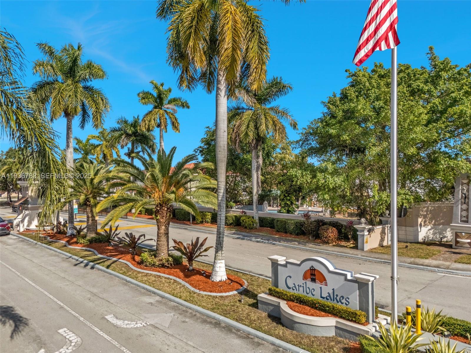3725 Southwest 153rd Court Miami, FL 33185 - Photo 4 of 22 a view of a street with cars on road