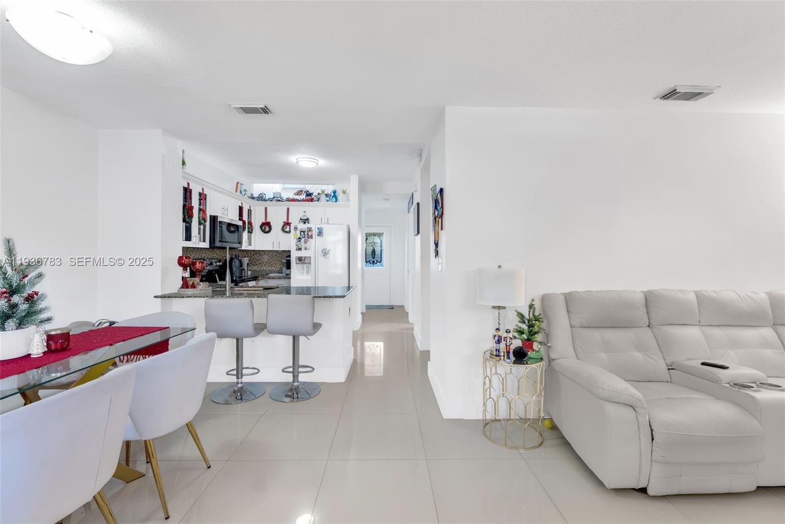 3725 Southwest 153rd Court Miami, FL 33185 - Photo 5 of 22 a living room with furniture and a couch