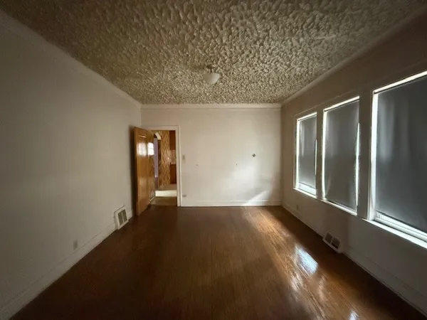 a view of an empty room and window