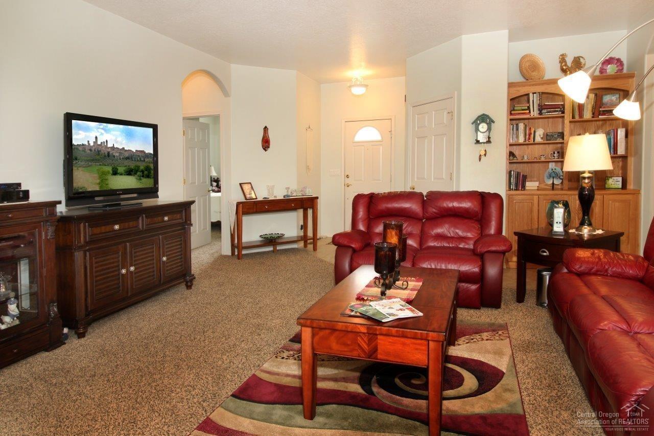 381 Southeast Soft Tail Loop Bend, OR 97702 - Photo 4 of 24 Living room view back toward the foyer.