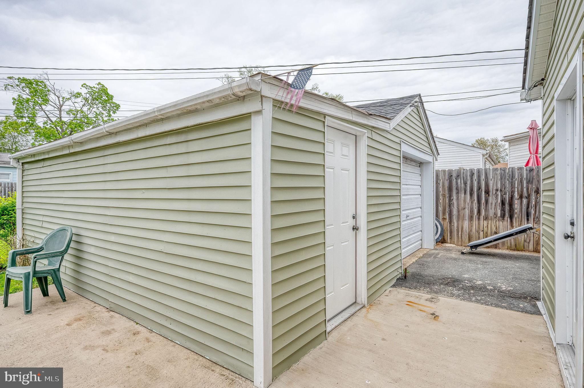 4 Right Aileron Baltimore, MD 21220 - Photo 24 of 30 a view of a house with a small yard and wooden floor and fence
