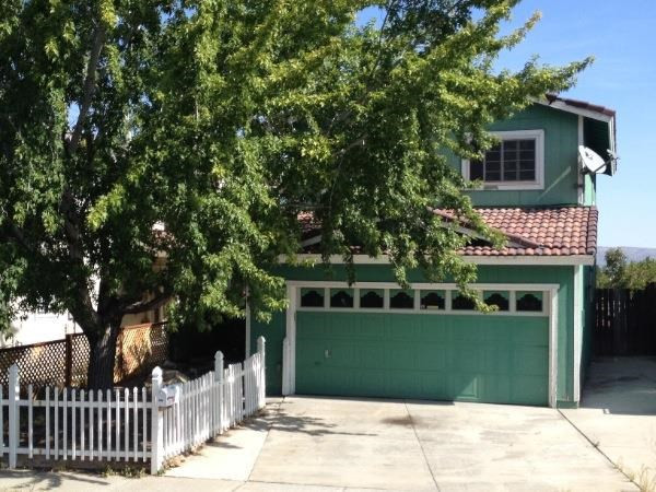 6915 Peppermint Drive Reno, NV 89506 - Photo 1 of 1 a front view of a house with a garden