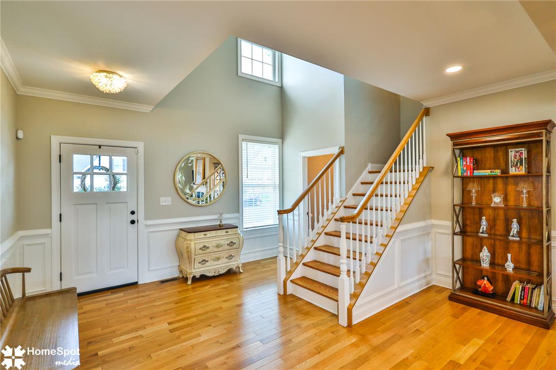 4473 Old Saucon Road Bethlehem, PA 18015 - Photo 3 of 26 Gleaming hardwood floors and classic wainscoting define this welcoming two-story entryway.