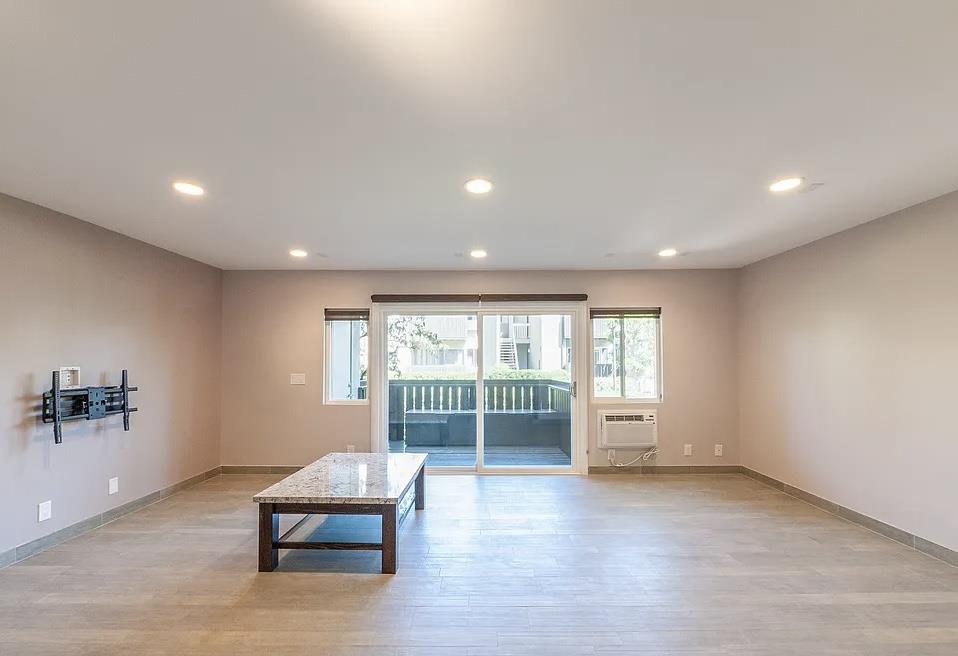 4927 Indian Wood Road Culver City, CA 90230 - Photo 12 of 20 a view of an empty room with a window and wooden floor
