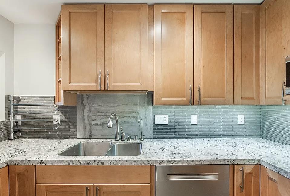 4927 Indian Wood Road Culver City, CA 90230 - Photo 19 of 20 a kitchen with granite countertop a sink and dishwasher cabinets with granite countertops