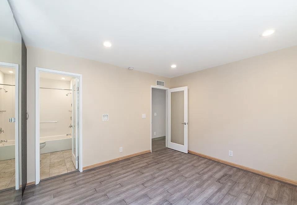 4927 Indian Wood Road Culver City, CA 90230 - Photo 4 of 20 a view of an empty room with wooden floor