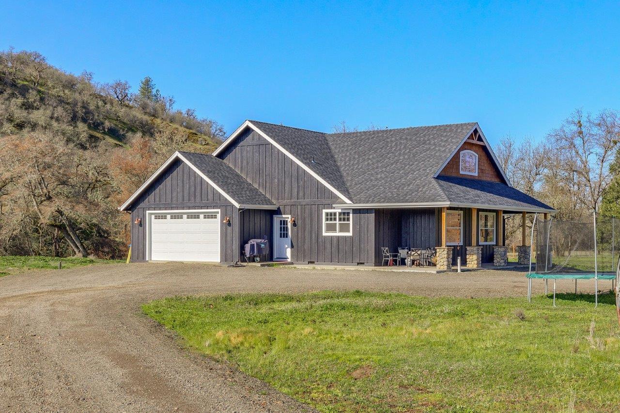 4684 Brownsboro-Meridian Road Eagle Point, OR 97524 - Photo 22 of 33 a front view of a house with yard and green space