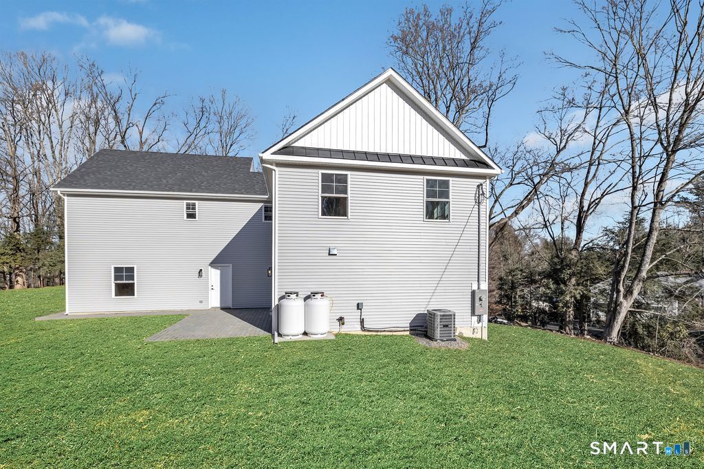 100 Tashua Road Trumbull, CT 06611 - Photo 25 of 29 a view of a yard in front of a house with plants and large tree