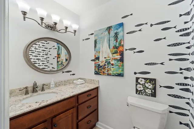 a spacious bedroom with a bed a couch and dresser