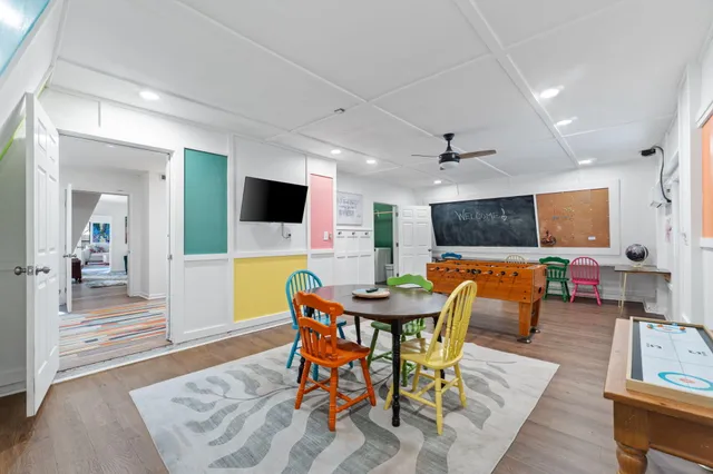 a view of a dining room with furniture and wooden floor