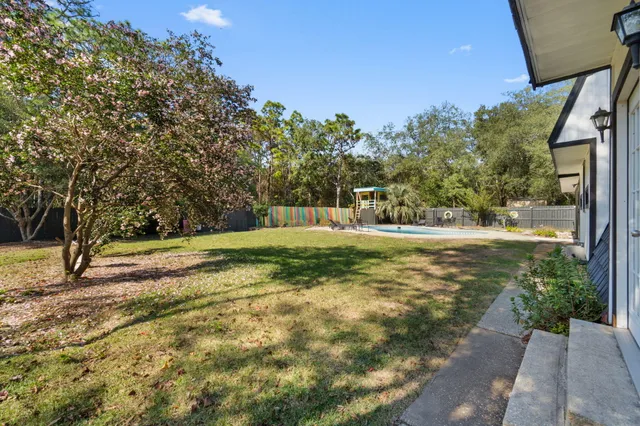 a view of swimming pool with seating space