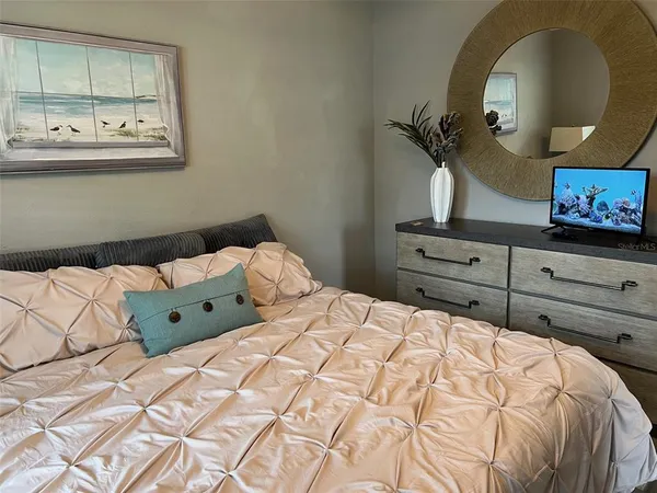 a living room with a table chairs and a fireplace