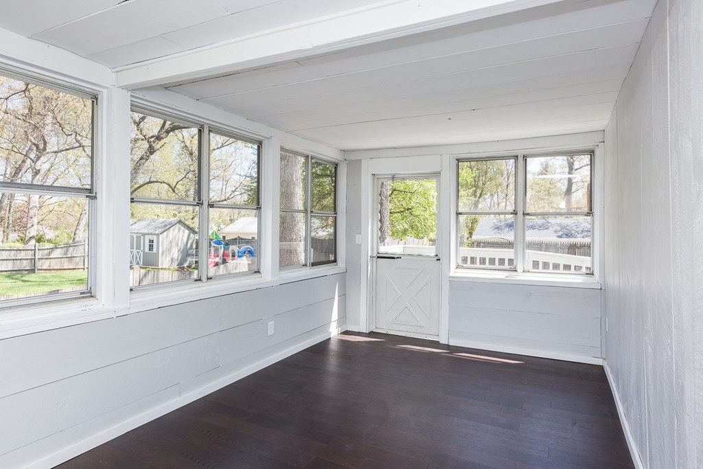 219 Cooper Street Springfield, MA 01108 - Photo 13 of 29 an empty room with wooden floor and a window