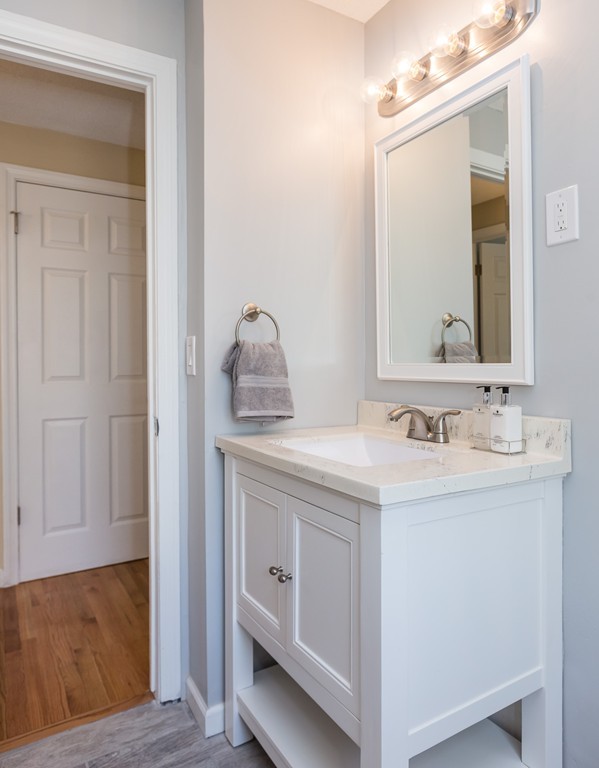219 Cooper Street Springfield, MA 01108 - Photo 14 of 29 a bathroom with a sink and a mirror