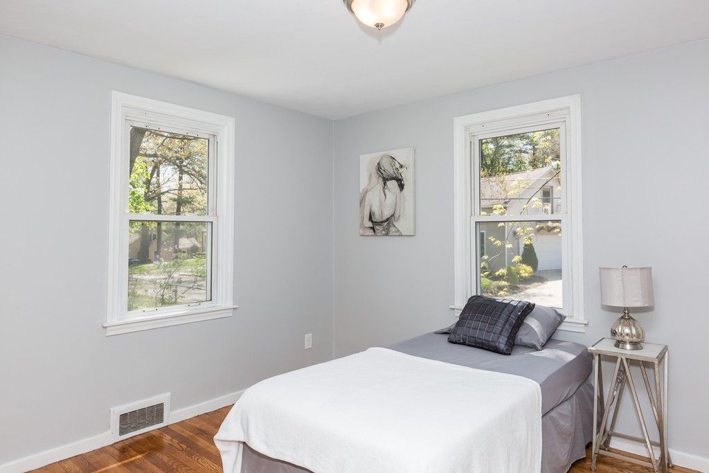 219 Cooper Street Springfield, MA 01108 - Photo 18 of 29 a bedroom with a bed and a window